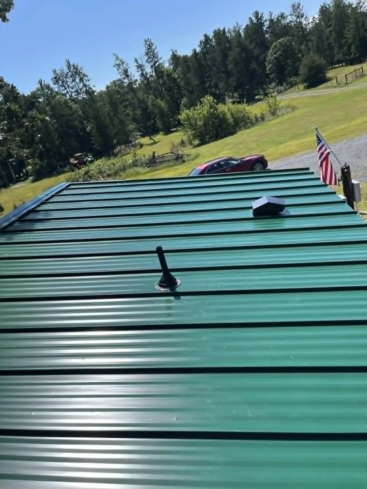 A vivid green standing-seam metal roof