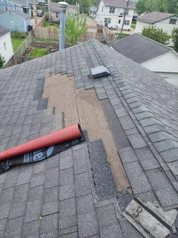 A worn pipe boot and shingles being tuned up on a New Summit Roofing job