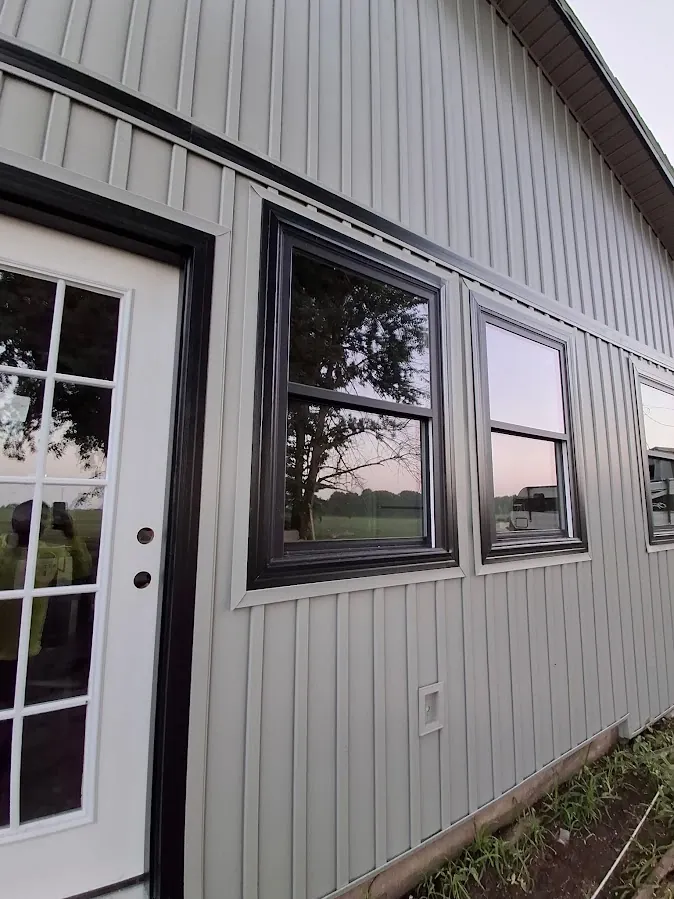 Close-up of clean gray lap siding and trim